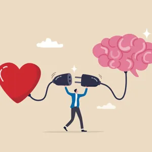 En person som kobler sammen en hjerne og et hjerte med en ledning