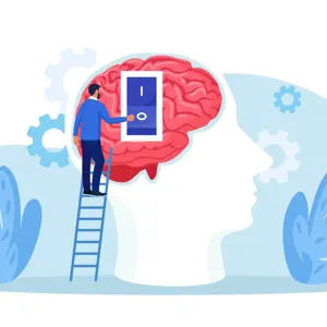 En person som står på en stige og trykker på en av/på-knapp på en hjerne