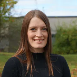 A woman smiling for the camera