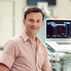 A man smiling to the camera