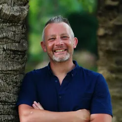 A man with his arms crossed