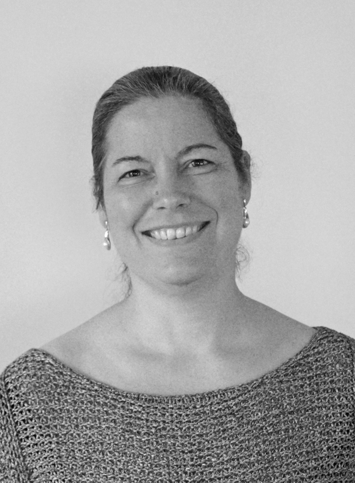 En person som smiler til kameraet