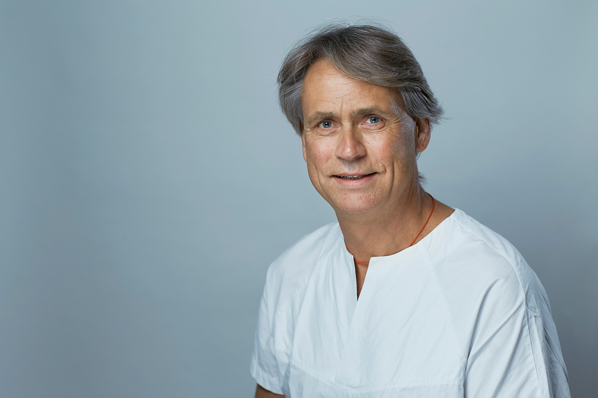 A male doctor in a white shirt